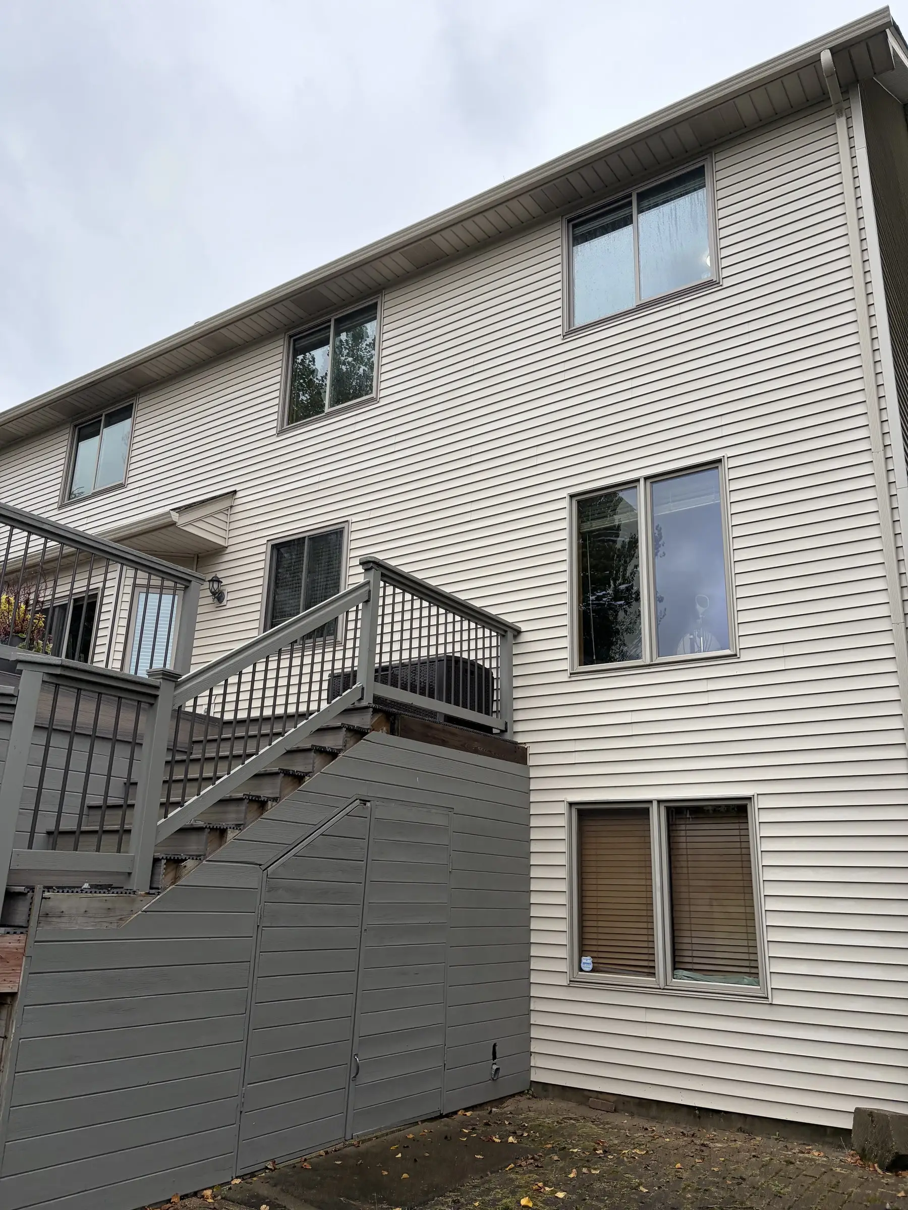 After: the same home with clean siding