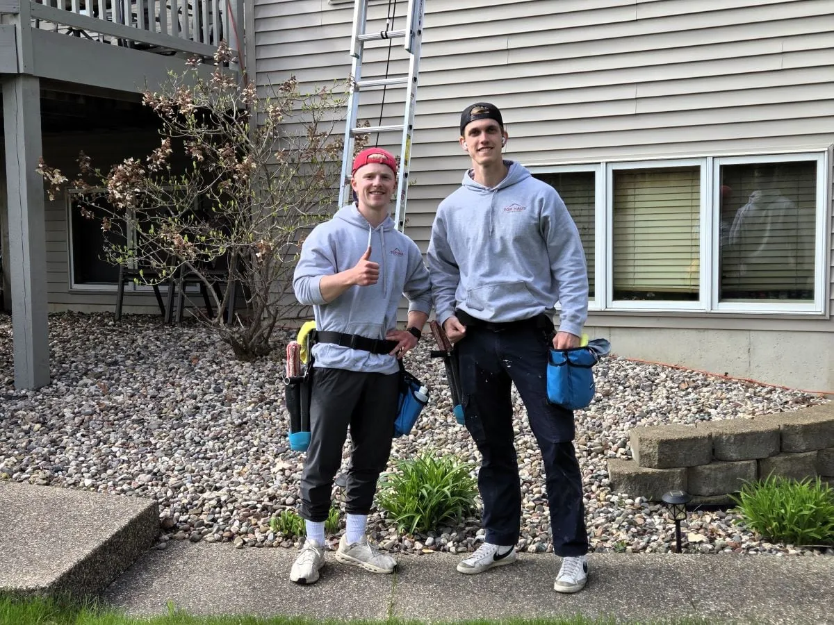 Sam and Reece of Top Haus Exteriors with their ladder and tool belts