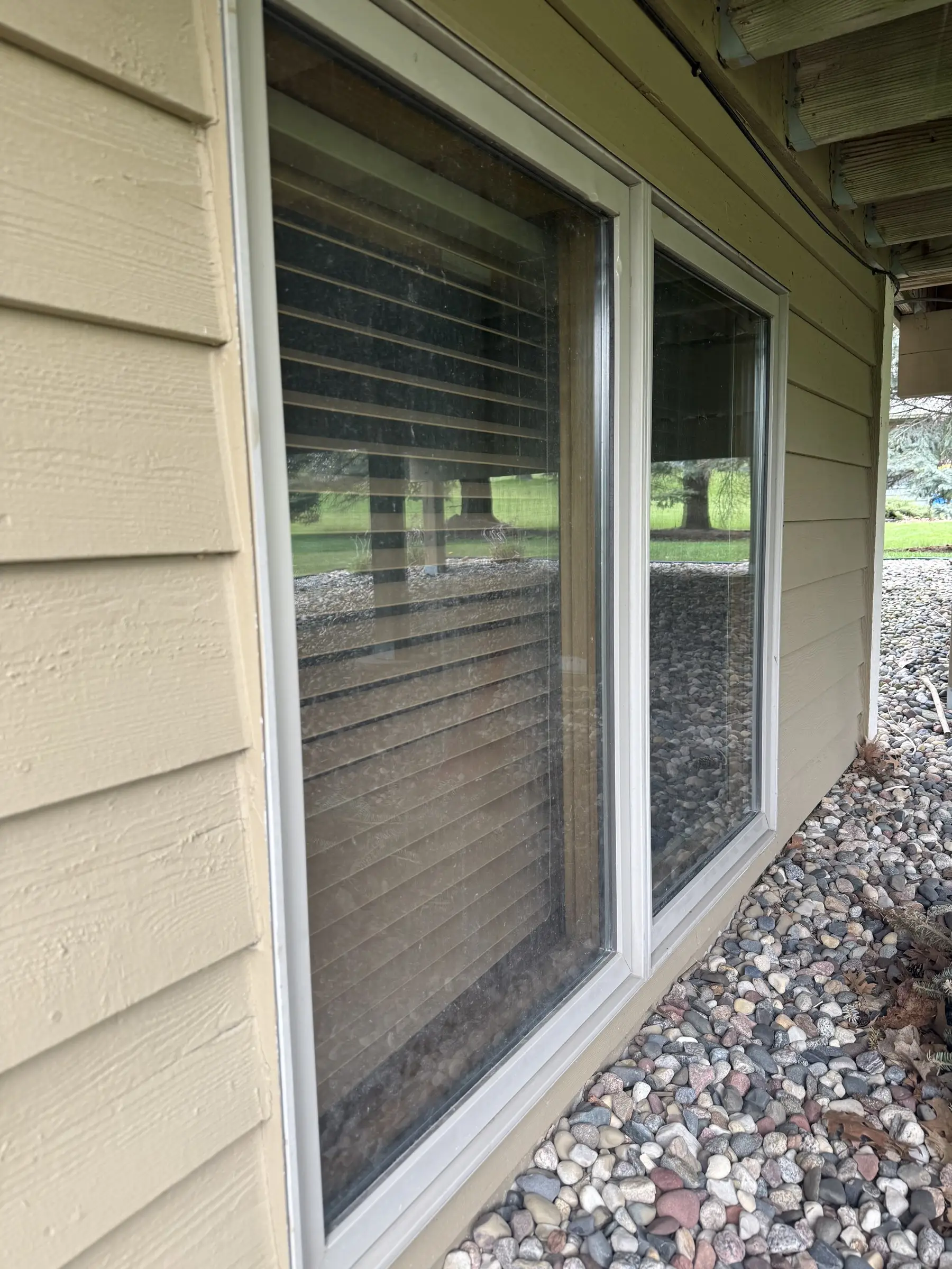 Before: a ground-level sliding window before cleaning